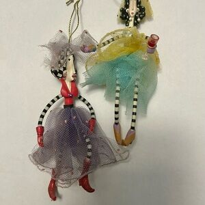 Whimsical Hanging Figurines with Red and Yellow Accents